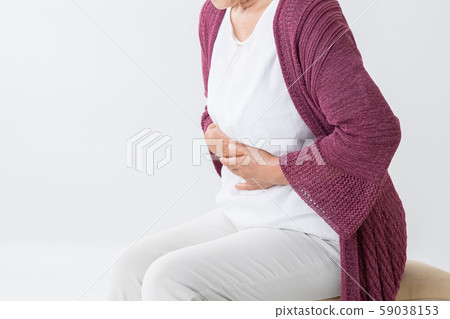 Elderly woman with a stomachache 59038153