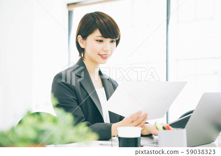 A woman working in a bright office 59038323