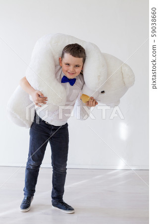 Beautiful boy with toy big polar bear Beautiful boy with toy big polar bear 59038660