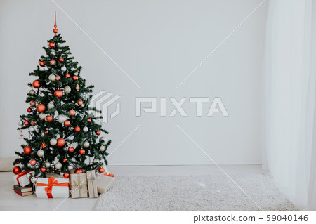 Christmas tree with red gifts in the white room Christmas 59040146