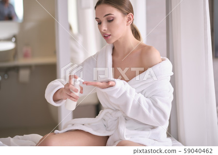 Young woman with flawless skin, applying Young woman with flawless skin, applying 59040462