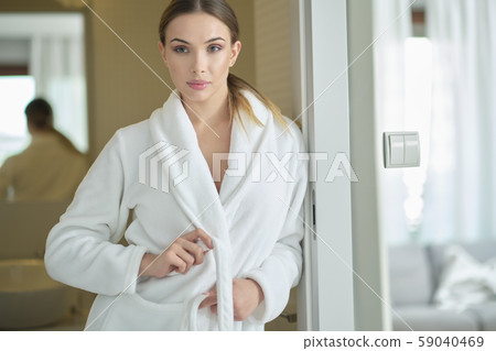 Close up of body of young woman tying up belt of Close up of body of young woman tying up belt of 59040469