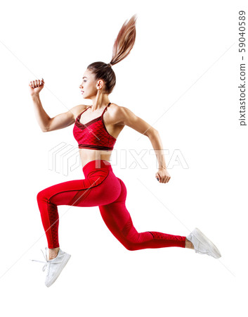Young woman runner in red sportswear jump in the air. Young woman runner in red sportswear jump in the air. 59040589