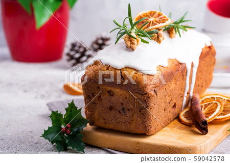 Fruit loaf cake dusted with icing, nuts and dry Fruit loaf cake dusted with icing, nuts and dry 59042578