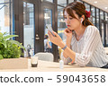 A broken heart who is depressed while listening to music at a share office 59043658