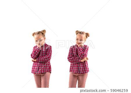 Young handsome girl arguing with herself on white studio background. Young handsome girl arguing with herself on white studio background. 59046259