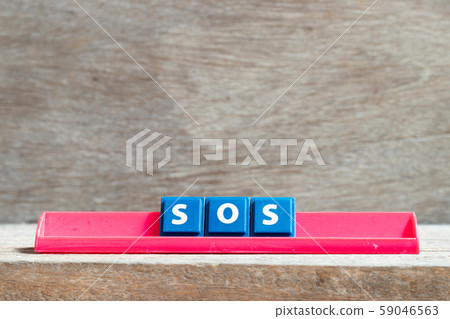 Tile letter on red rack in word SOS Tile letter on red rack in word SOS 59046563