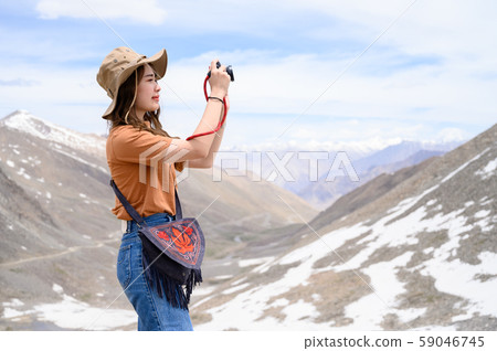 Young woman enjoy her camera in journey 59046745