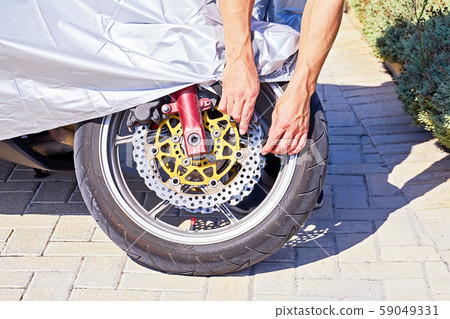 Closeup view of motorcycle wheel with waterproof Closeup view of motorcycle wheel with waterproof 59049331
