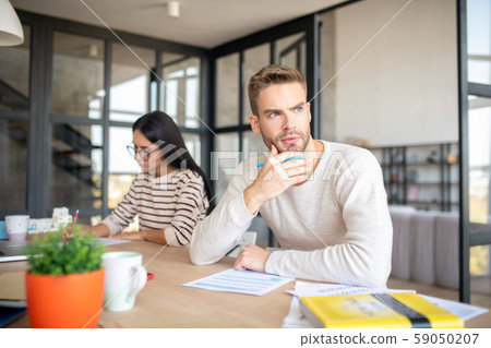 Man feeling concerned after feeling tax declaration Man feeling concerned after feeling tax declaration 59050207