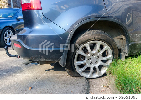 a traffic accident on a city street, a car with a 59051363
