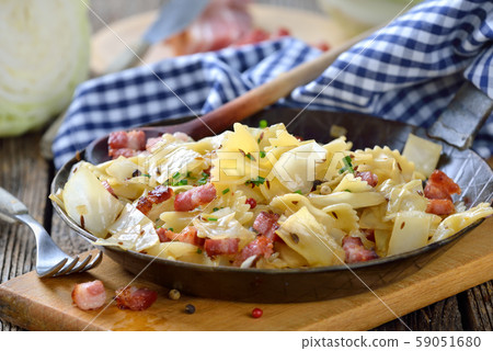 Pasta with fried white cabbage and bacon, an Austrian specialty called 'Krautfleckerl' 59051680