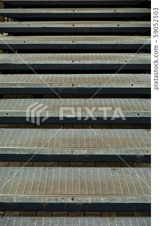 Metal mesh stairs near the entrance to high block of flats 59052503