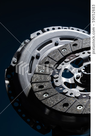 Car parts, brake disc on dark backdrop Car parts, brake disc on dark backdrop 59052683