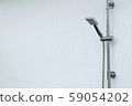 Shower head beside the pool 59054202