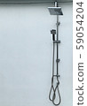 Shower head beside the pool 59054204