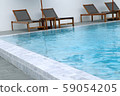 Chair loungers by the pool 59054205