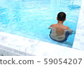 boy swimming in the pool 59054207