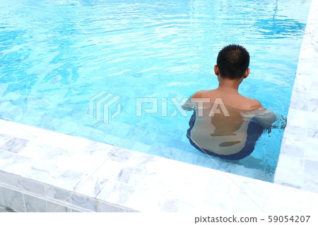 boy swimming in the pool boy swimming in the pool 59054207