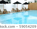 Chair loungers by the pool 59054209
