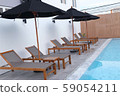 Chair loungers by the pool 59054211