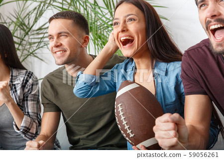 Group of friends sport fans watching rugby match close-up happy Group of friends sport fans watching rugby match close-up happy 59056261