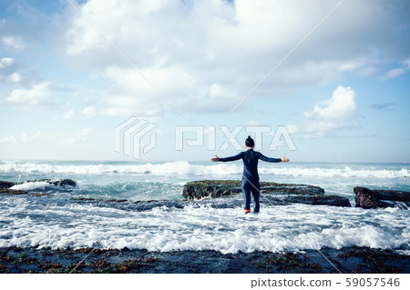 Freedom woman outstretched arms at seaside mossy Freedom woman outstretched arms at seaside mossy 59057546