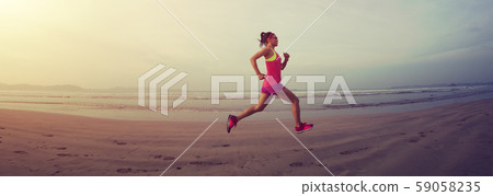 Fitness woman runner running on sunrise beach 59058235