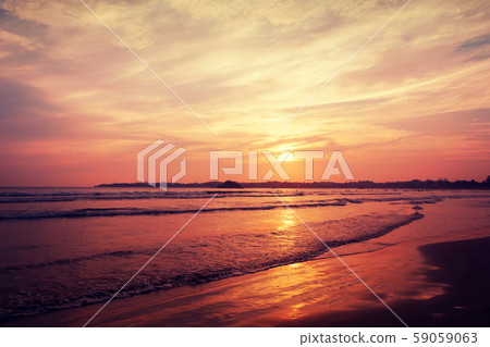 Beautiful sunset on sandy beach Beautiful sunset on sandy beach 59059063
