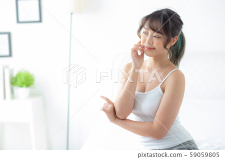 Portrait of beautiful young asian woman smile while wake up healthy and wellness Portrait of beautiful young asian woman smile while wake up healthy and wellness 59059805