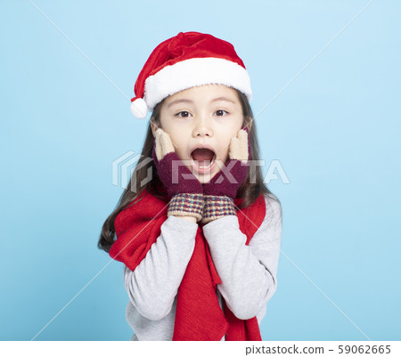 surprised  little girl in Santa hat 59062665