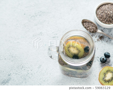 Kiwi and blueberry chia water in mason jar Kiwi and blueberry chia water in mason jar 59063129