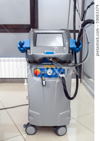 Cosmetology Service. Revolutionizing dynamic laser for hair removal device in clinic close-up Cosmetology Service. Revolutionizing dynamic laser for hair removal device in clinic close-up 59063374