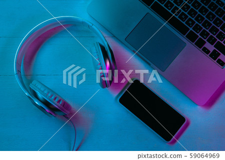 Top view of set of gadgets in purple neon light 59064969