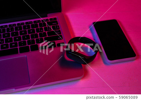 Top view of set of gadgets in purple neon light 59065089