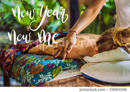 NEW YEAR NEW ME concept Young beautiful relaxing woman getting spa massage of shoulder in beauty NEW YEAR NEW ME concept Young beautiful relaxing woman getting spa massage of shoulder in beauty 59065096