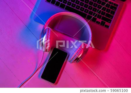 Top view of set of gadgets in purple neon light 59065100