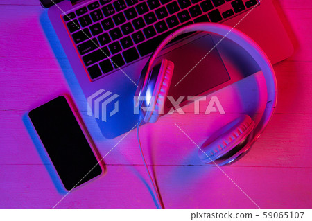Top view of set of gadgets in purple neon light Top view of set of gadgets in purple neon light 59065107