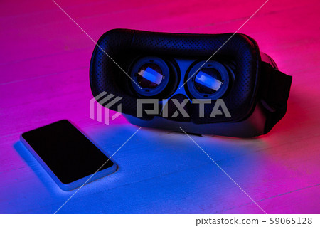 Top view of set of gadgets in purple neon light Top view of set of gadgets in purple neon light 59065128