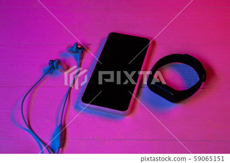 Top view of set of gadgets in purple neon light Top view of set of gadgets in purple neon light 59065151