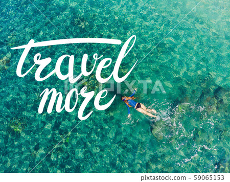 TRAVEL MORE concept Happy woman in snorkeling mask dive underwater with tropical fishes in coral TRAVEL MORE concept Happy woman in snorkeling mask dive underwater with tropical fishes in coral 59065153