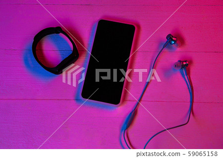 Top view of set of gadgets in purple neon light Top view of set of gadgets in purple neon light 59065158