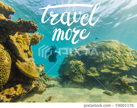 TRAVEL MORE concept Happy man in snorkeling mask dive underwater with tropical fishes in coral reef 59065176