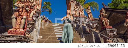 Young woman tourist in budhist temple Brahma Vihara Arama Bali BANNER, LONG FORMAT Young woman tourist in budhist temple Brahma Vihara Arama Bali BANNER, LONG FORMAT 59065453