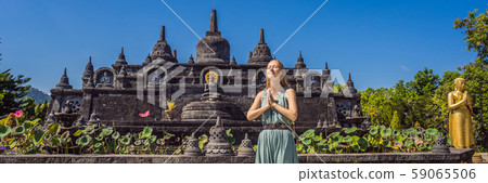 Young woman tourist in budhist temple Brahma Vihara Arama Banjar Bali, Indonesia BANNER, LONG FORMAT Young woman tourist in budhist temple Brahma Vihara Arama Banjar Bali, Indonesia BANNER, LONG FORMAT 59065506