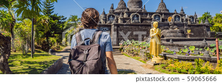 Young man tourist in budhist temple Brahma Vihara Arama Banjar Bali, Indonesia BANNER, LONG FORMAT 59065666