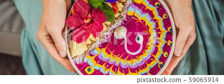 BANNER, LONG FORMAT Young woman having a mediterranean breakfast seated at her sofa and eats Healthy BANNER, LONG FORMAT Young woman having a mediterranean breakfast seated at her sofa and eats Healthy 59065914