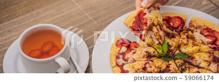 Woman eating delicious strawberry pizza on a balinese tropical nature background. Bali island 59066174