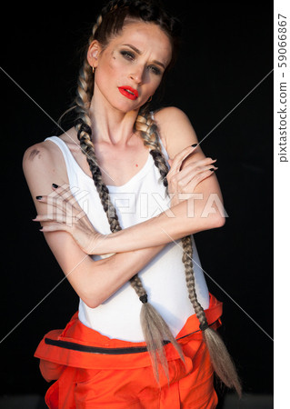 Portrait of a beautiful woman mechanic with two braids Portrait of a beautiful woman mechanic with two braids 59066867