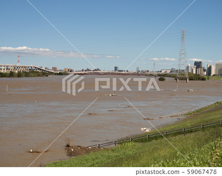 Arakawa flooded by a typhoon, Adachi-ku, Tokyo 59067478